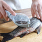 Close-up of the ergonomic Fish Scale Scraper for efficient fish cleaning.