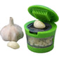 Close-up of the Quickslice manual garlic mincer, showing its compact design.