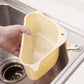 Sink drainer shelf with segmented compartments for kitchen tools.