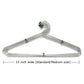 Elegant stainless steel hangers in a modern closet, perfect for keeping clothes wrinkle-free.