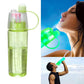 Refreshing 600ML spray bottle alongside fresh fruits, promoting healthy hydration.