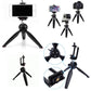 Mini tripod with a smartphone mounted, demonstrating its use as a stable phone stand.