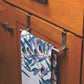 A shiny stainless steel towel rod, wall-mounted for efficient bathroom space.