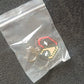 Pixel style acrylic keychain displayed on black background showcasing retro heart