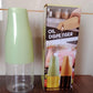 The 500ml oil dispenser filled with cooking oil, ready for use on the counter.