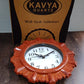 Aesthetic wooden look round wall clock elegantly displayed in a contemporary room setting.