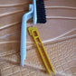 Close-up view of rotating floor scrub brush designed for tough dirt removal