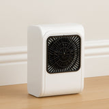 Compact brown box room heater on a clean surface.