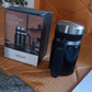 Vacuum coffee cup exhibiting ergonomic handle and stainless steel body design