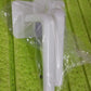 Detailed view of the strong, transparent adhesive hook used for mounting the storage rack without damaging walls.