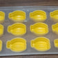 Glass of chilled beverage with delightful fruit-shaped ice cubes and the silicone mold.
