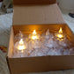 The Flameless LED Tealight Candles box packaging, showing 24 pieces.