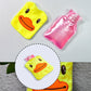 Person using the yellow duck hot water bag for neck pain relief.