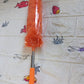 Hand demonstrating the easy length adjustment mechanism of the extendable duster handle.