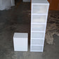 Multi-functional storage cart in a laundry room, holding detergents and supplies.