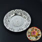 Silver color plastic Pooja Thali set with kumkum holders for rituals.