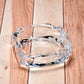 Versatile glass ashtray designed for both indoor and outdoor environments.