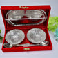 The two silver plated bowls and spoons neatly placed inside the rich red velvet gift box, ready for gifting.