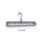 Close-up view of the nine precisely designed holes on the plastic hanger for secure garment storage.