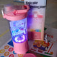 The electric portable juicer glowing with dynamic multicolor lighting effects.