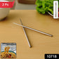 Close-up of sleek stainless steel chopsticks resting on a dining table.