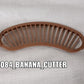 Compact plastic banana cutter with comfortable grip for daily use.