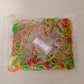Pile of flexible nylon rubber bands, suitable for a wide range of organizing tasks.