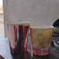 Overhead view of disposable paper cups, emphasizing their vibrant and appealing designs.