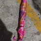 An open 3-fold umbrella displaying its water-repellent fabric and classic pattern.