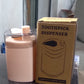 Automatic toothpick dispenser in a minimalist setting, ready for use.