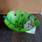 Decorative leaf-shaped fruit basket placed on kitchen countertop
