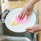 Close-up of a mildew-free silicone dish sponge in assorted colors, highlighting its gentle scrubbing bristles.