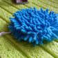 Stack of clean microfiber hand towels on a bathroom shelf.