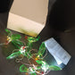 Solar hummingbird wind chime hanging on patio as garden decor