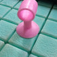 Mini silicone door stopper demonstrating multiple uses