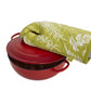 Hand holding a hot tray with the Heat Proof Oven Glove, demonstrating protection.