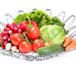 Multipurpose stainless steel wire basket displayed with vegetables, highlighting its versatility.