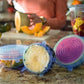 Airtight silicone food cover stretching over a bowl of fresh vegetables.