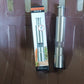 Compact stainless steel thumb press salt and pepper grinder on a wooden surface.