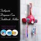 Step-by-step diagram showing how to easily install a toothpaste tube into the dispenser.