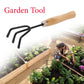 Ergonomic black handle of the steel hand cultivator, designed for comfortable use.