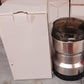 Contents of the ChefAura mini electric grinder package, including instructions.