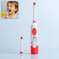 Close-up of the portable electric toothbrush with an extra brush head and batteries.
