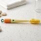 Close-up of bottle cleaning brush highlighting the silicone head and long handle.