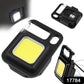 COB LED keychain flashlight illuminating a dark area