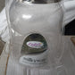 Lifestyle shot of an airtight plastic food storage jar in a modern kitchen setting.