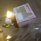 The Magnetic Parrot Night Lamp package content with batteries.