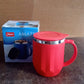 Person enjoying a hot beverage from the Apex insulated mug at an office desk.