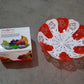 Stylish lifestyle shot of the folding fruit basket on a dining table, filled with fruits.