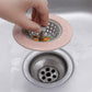 Silicone sink strainer basket actively in use within a busy kitchen sink.